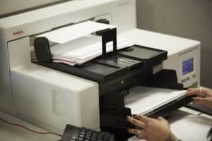 running paper through a kodak production scanner