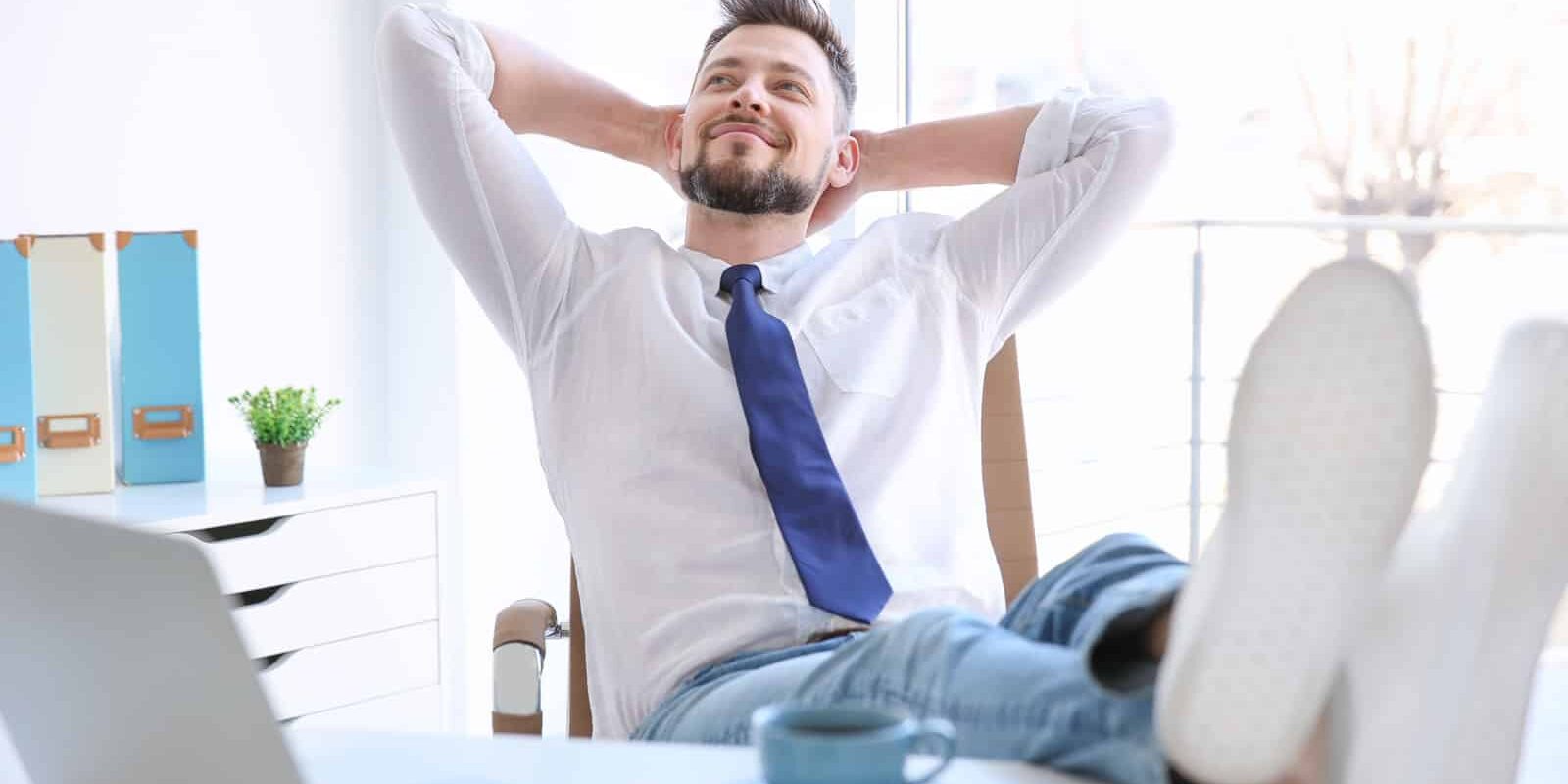 outsourced services man putting feet on desk